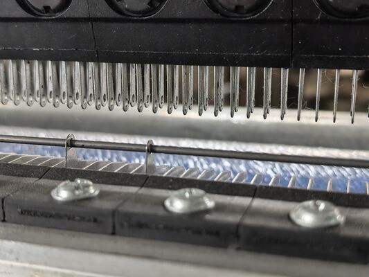 Comprender el papel de las barras de guía en las máquinas de tejer de warp